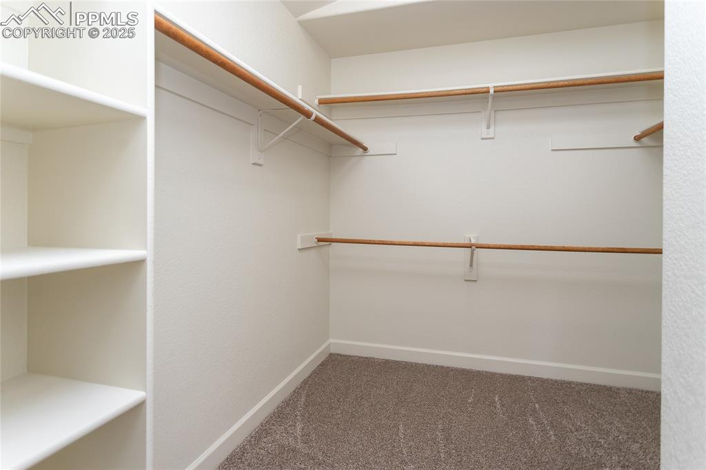 Image 21 of 38: Primary closet