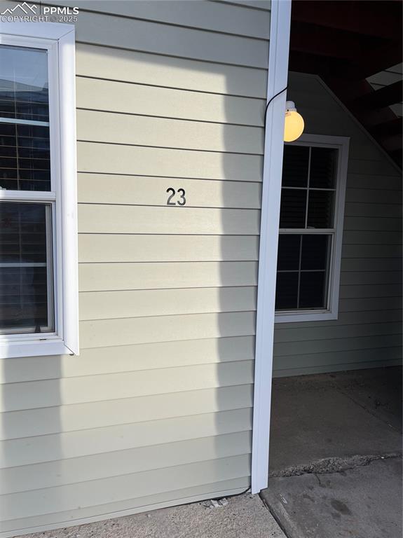 Caption: Although on second floor - unit is ground level to middle parking lot!!!  