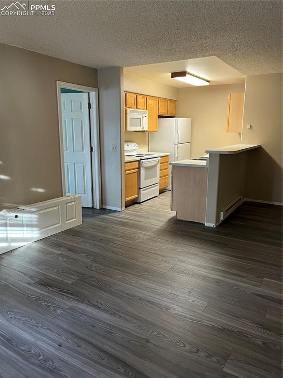 Image 3 of 7: Living / dining/kitchen GREAT room roomy and has new flooring as rest of th