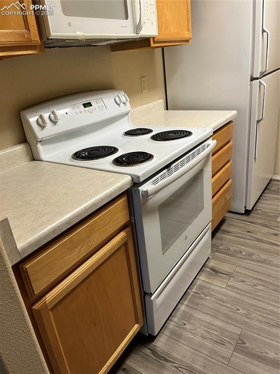 Image 4 of 7: Galley type kitchen sports microwave and dishwasher too!