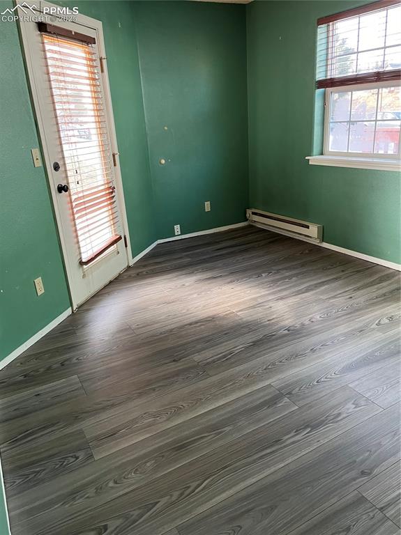Image 6 of 7: Has door to access patio at front of unit accessible from living room as we