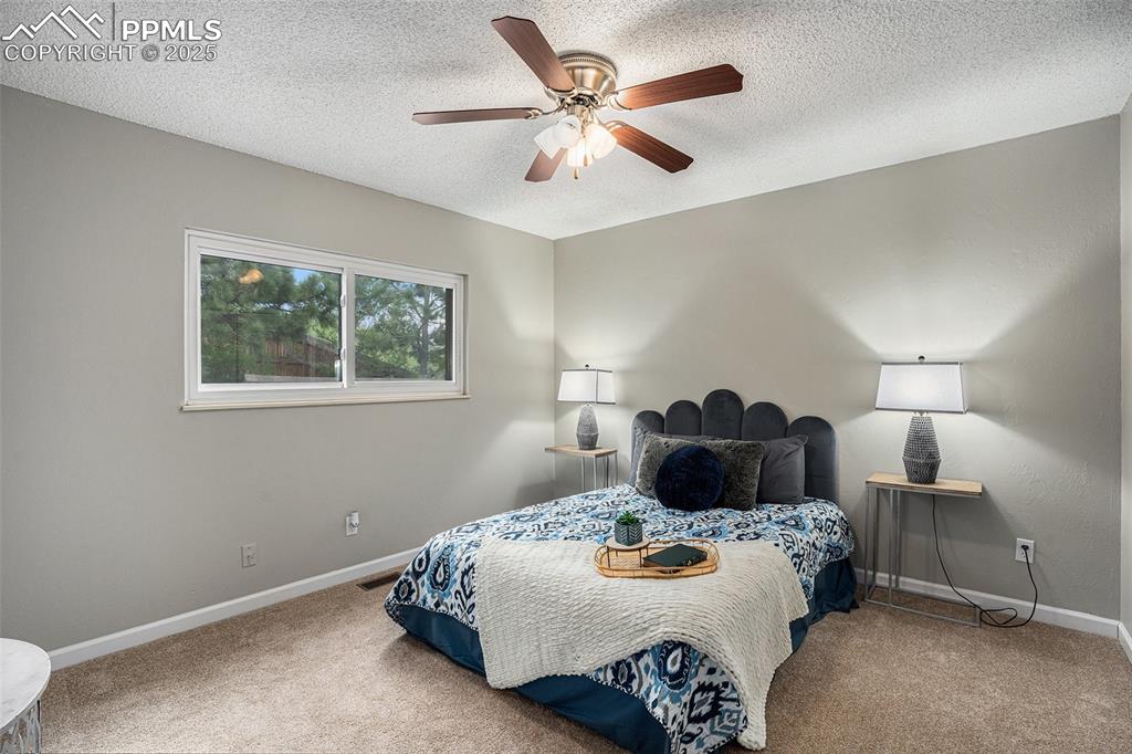 Image 20 of 34: Bedroom 2 with ceiling fan