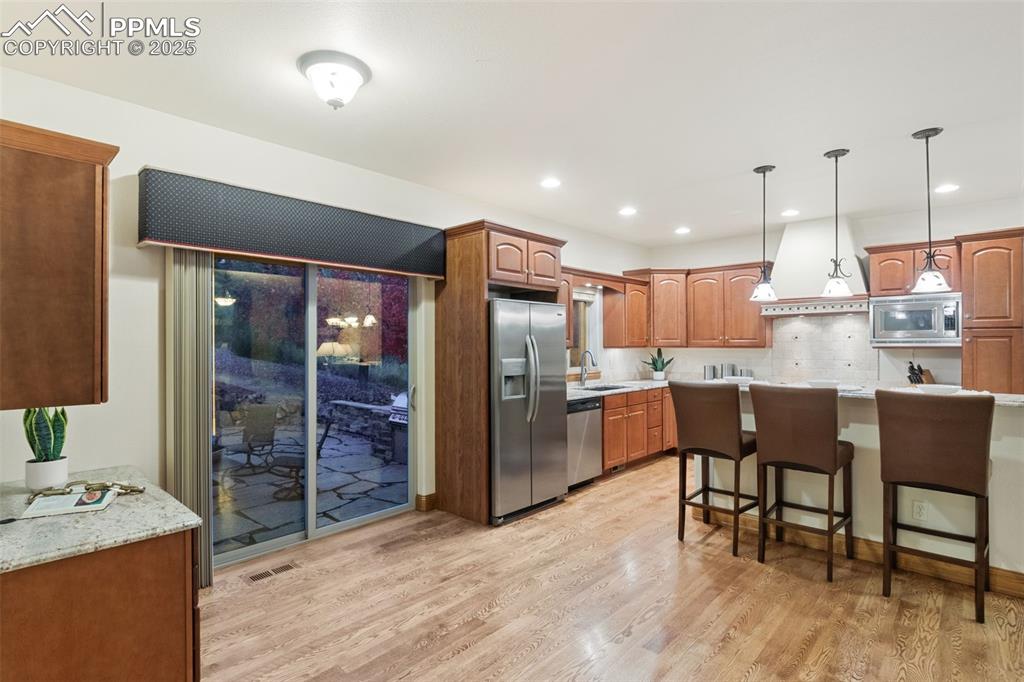 Image 14 of 47: Dining area with walkout to patio