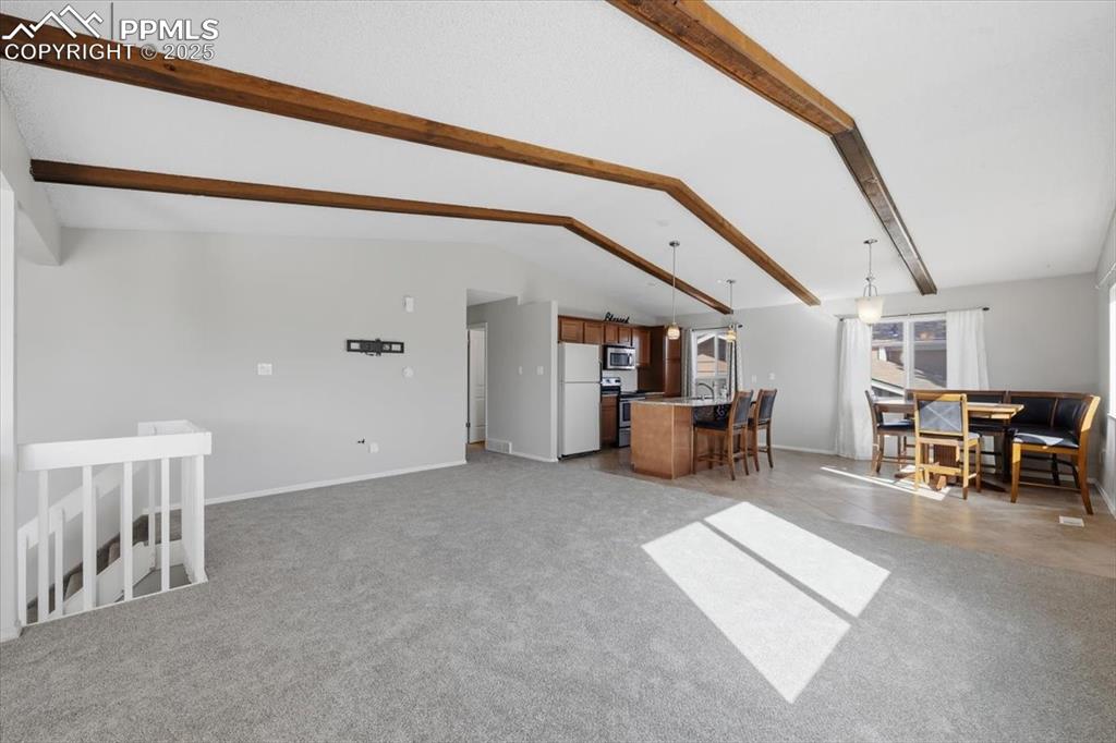 Image 20 of 47: Open living room with new carpet.