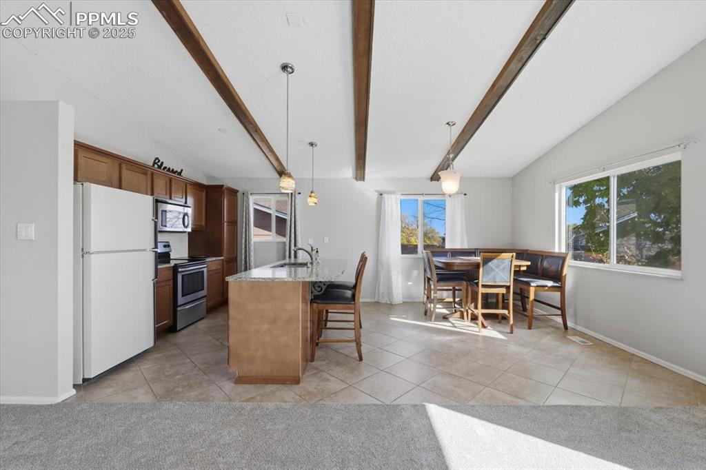 Image 21 of 47: Kitchen and dining area.