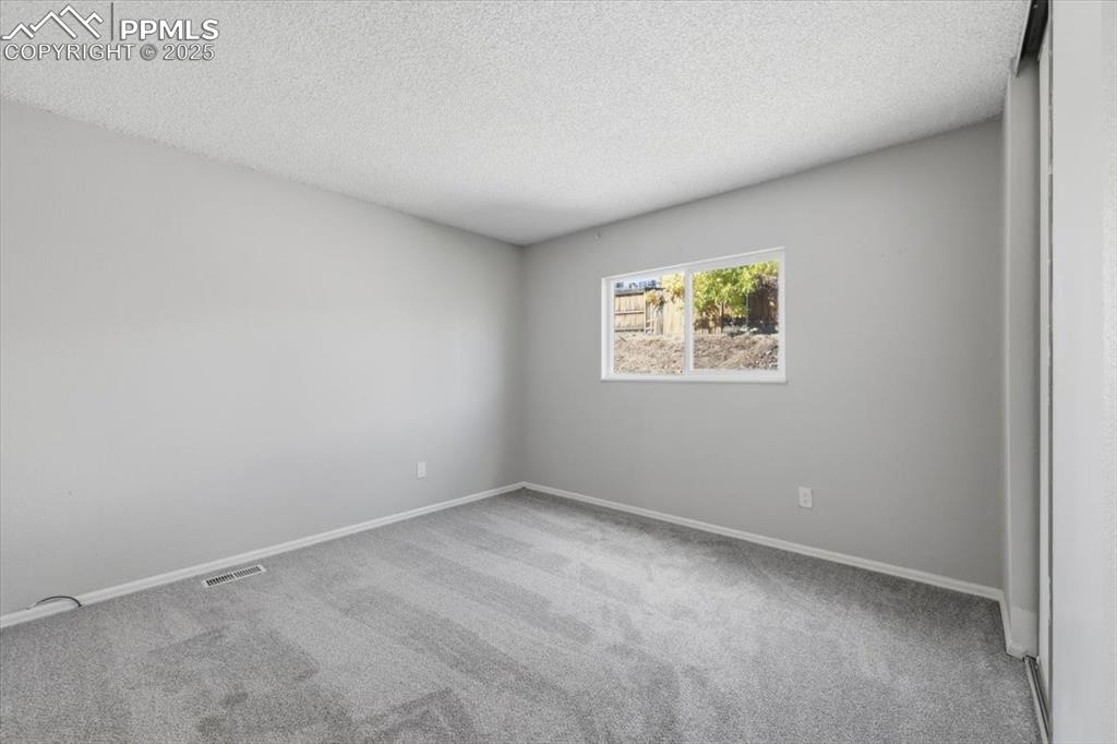 Image 30 of 47: 2nd main level bedroom.