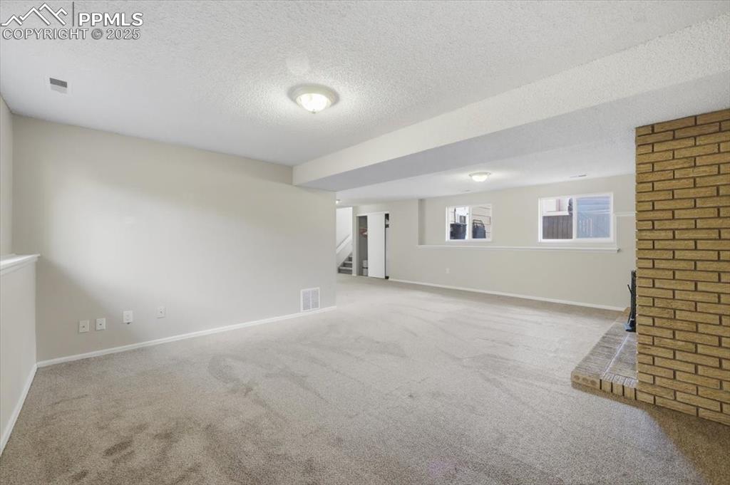 Image 38 of 47: Lower level family room.