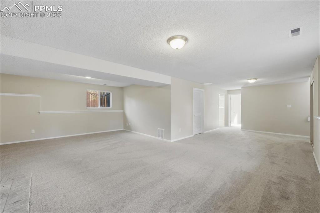 Image 39 of 47: Lower level family room.