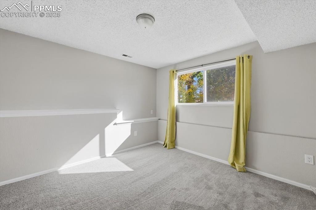 Image 40 of 47: lower level bedroom.