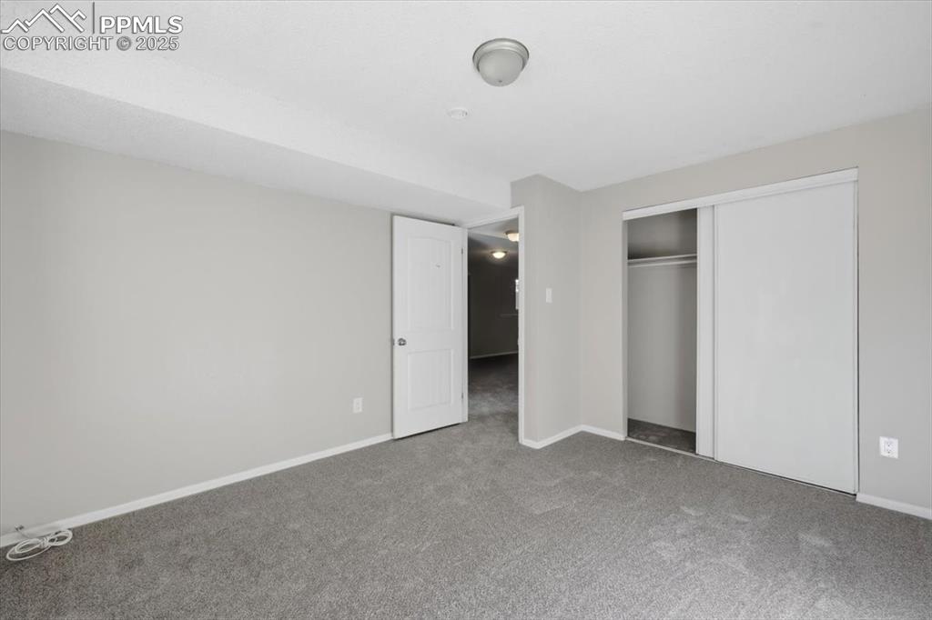 Image 41 of 47: Lower level bedroom.