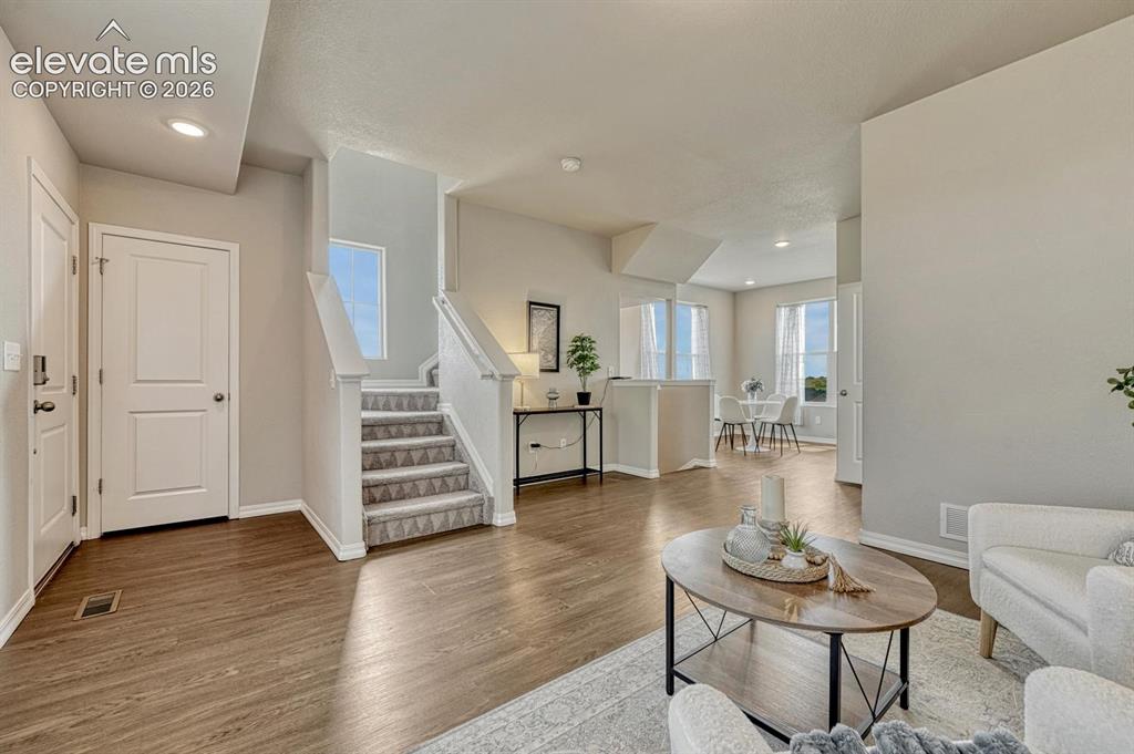 Image 13 of 40: Open floor plan where one floor flows from one room to another.