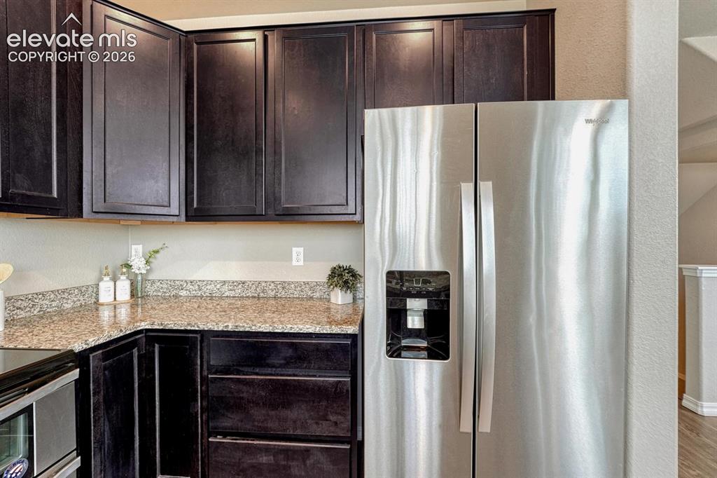 Image 19 of 40: Side by side stainless steel refrigerator.