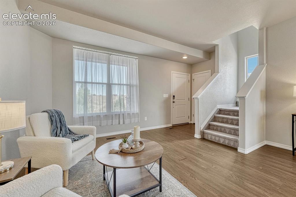 Image 2 of 40: The Entry walks into the formal Living Room with front views and beautiful 