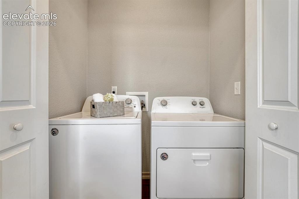 Image 26 of 40: Upper level Laundry Closet with washer and dryer included.