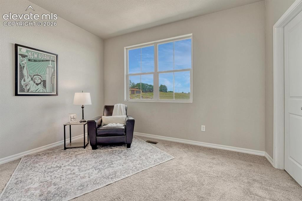 Image 27 of 40: Upper level Bedroom #2 has neutral carpet, private access to the Full Bathr