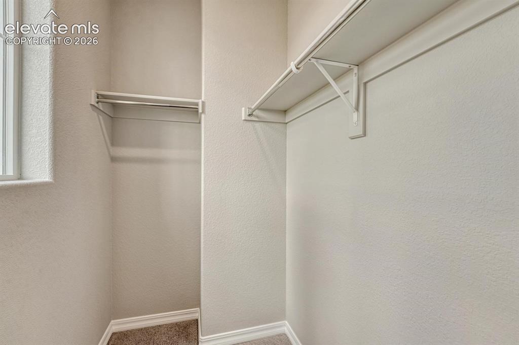 Image 32 of 40: Walk in closet in upper level Bedroom #2.
