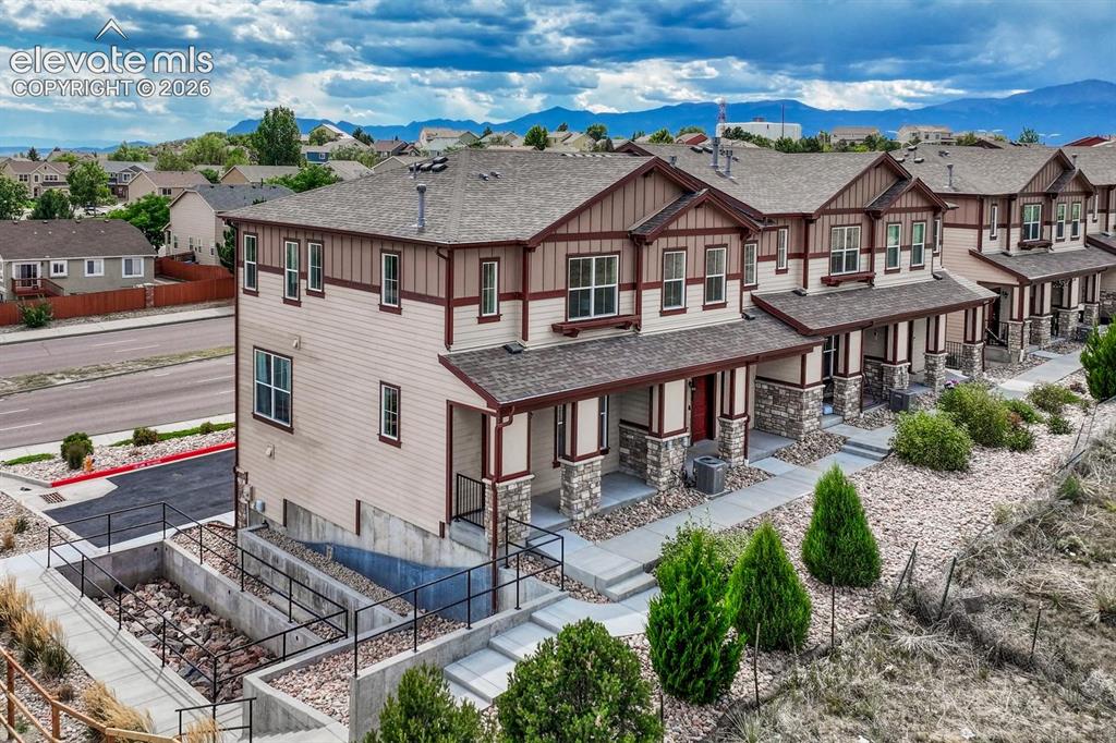 Image 35 of 40: Aerial front view of building that has open space views.