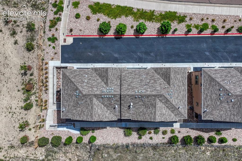 Image 37 of 40: Aerial view of building and lot.