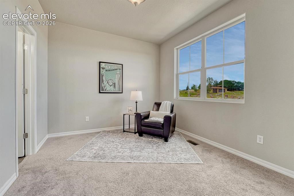 Image 7 of 40: Upper level Bedroom #2 could also be used as a home office, or sitting room