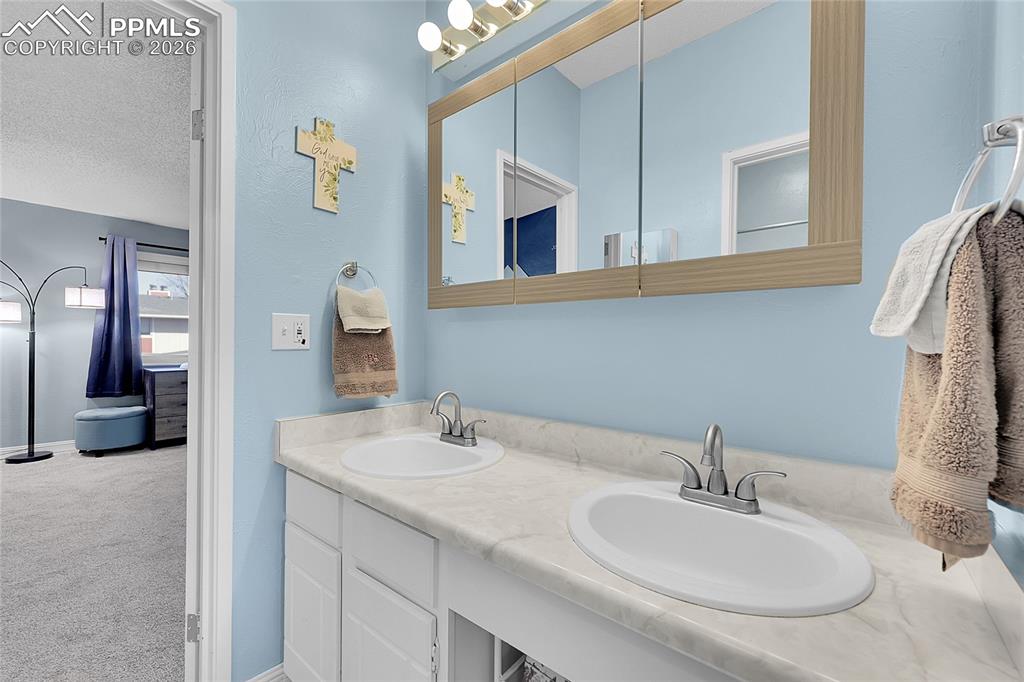 Image 14 of 30: Another view of Jack & Jill bathroom. 