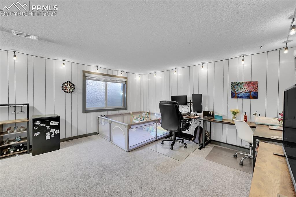 Image 17 of 30: Another view of basement family room. 