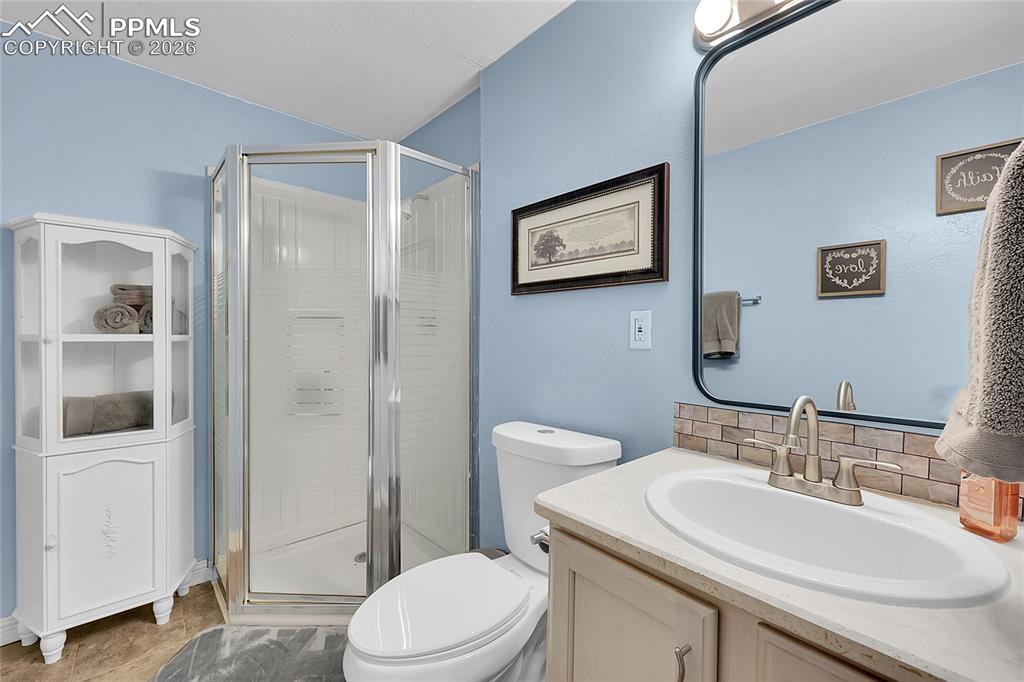 Image 18 of 30: 3/4 basement bathroom.