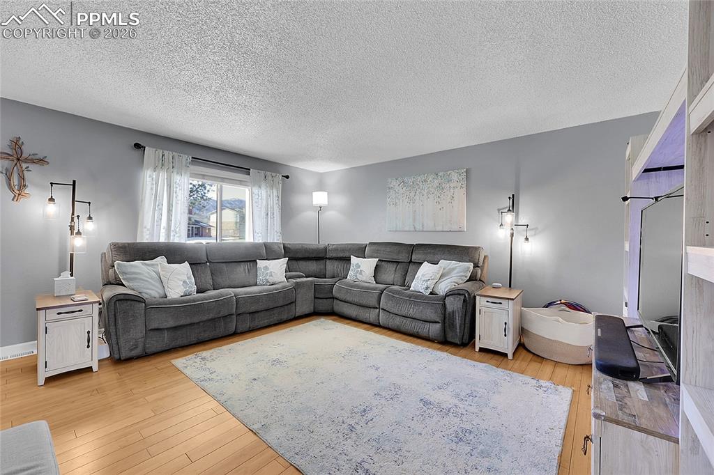 Image 4 of 30: Large picture window providing tons of natural lighting.