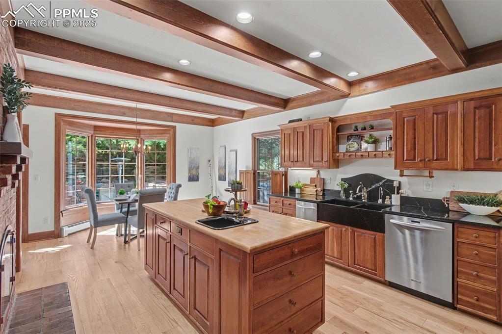 Image 10 of 27: Kitchen island with butcher block countertop