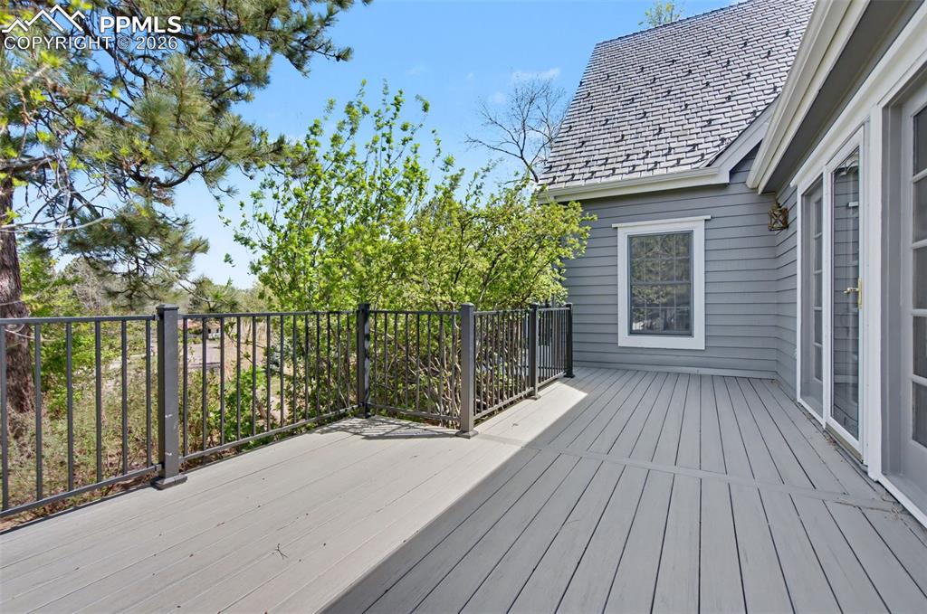 Image 16 of 27: front composite deck off large family room with mountain views