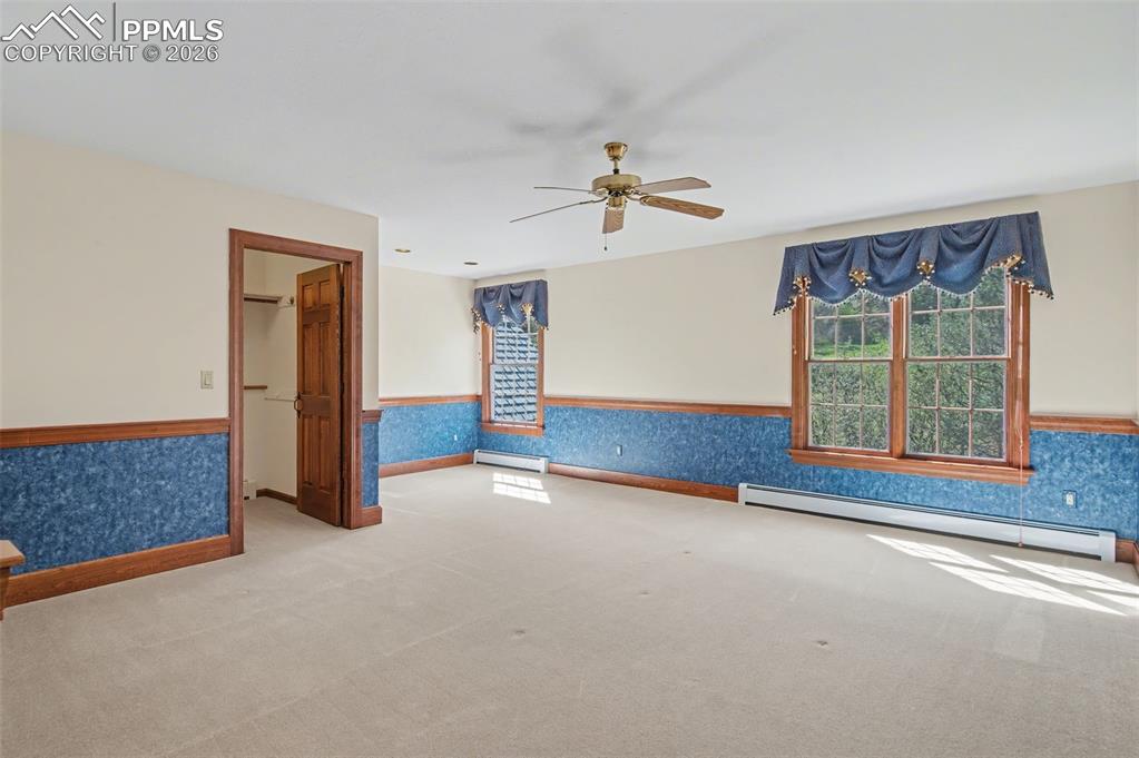 Image 17 of 27: Upper bedroom with walk in closet