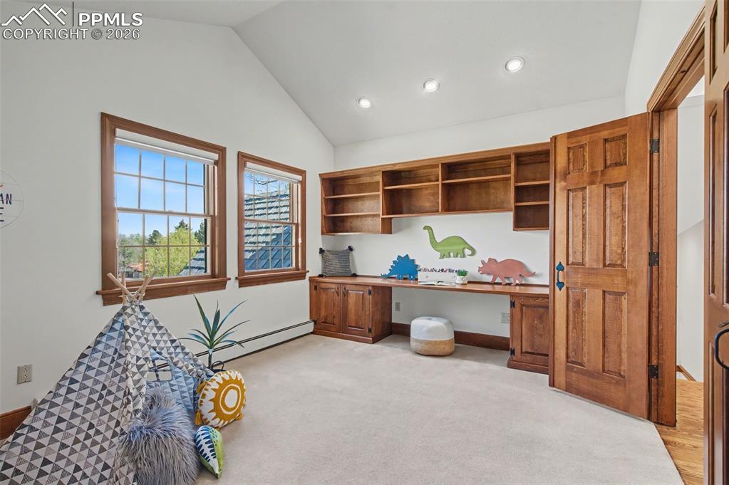 Image 20 of 27: upper bedroom with built-in desk & "surprise storage"