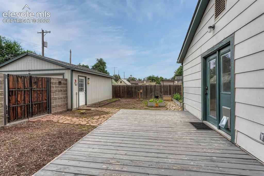 Image 41 of 50: Back deck off the primary bedroom