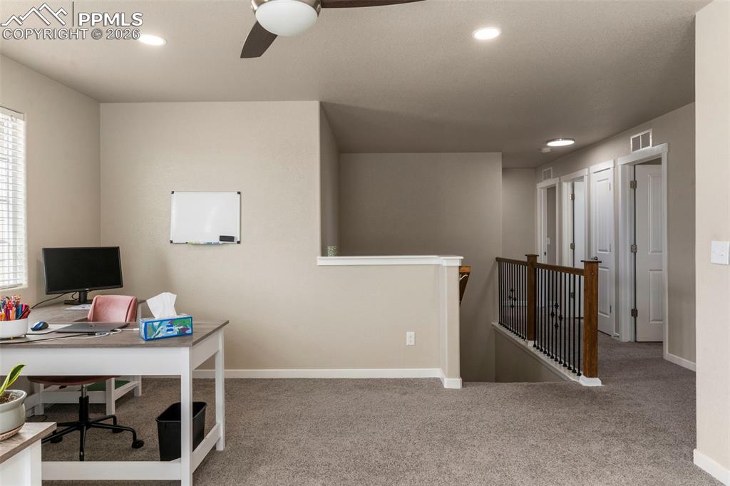 Image 19 of 32: Office featuring light colored carpet, a ceiling fan, and recessed lighting