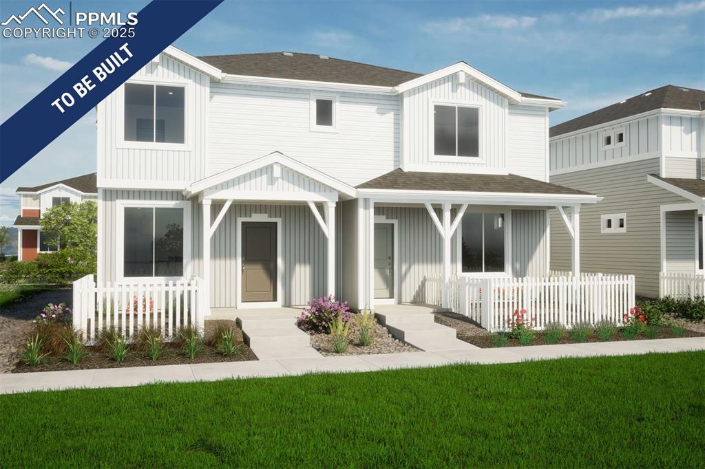 Caption: Back of property featuring board and batten siding, roof with shingles, and a porch