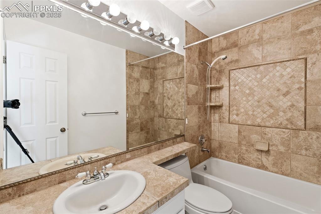 Image 21 of 27: Full bath featuring vanity and shower / bathtub combination