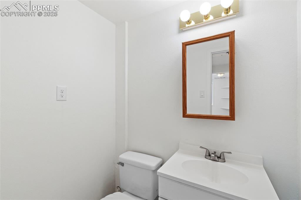 Image 23 of 27: Bathroom featuring toilet and vanity