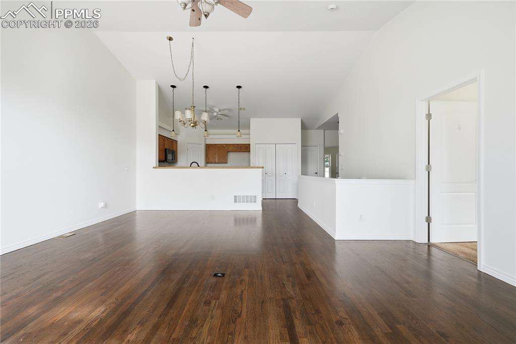 Image 11 of 41: Open floor plan features newly refinished hardwood floors and fresh paint
