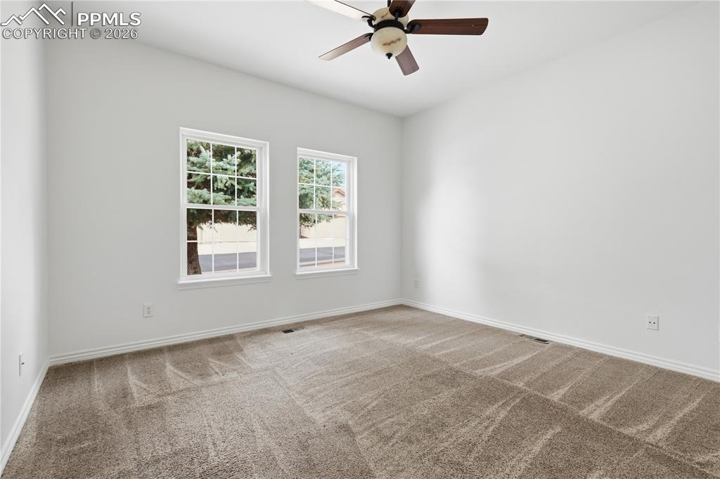 Image 18 of 41: Secondary main level bedroom