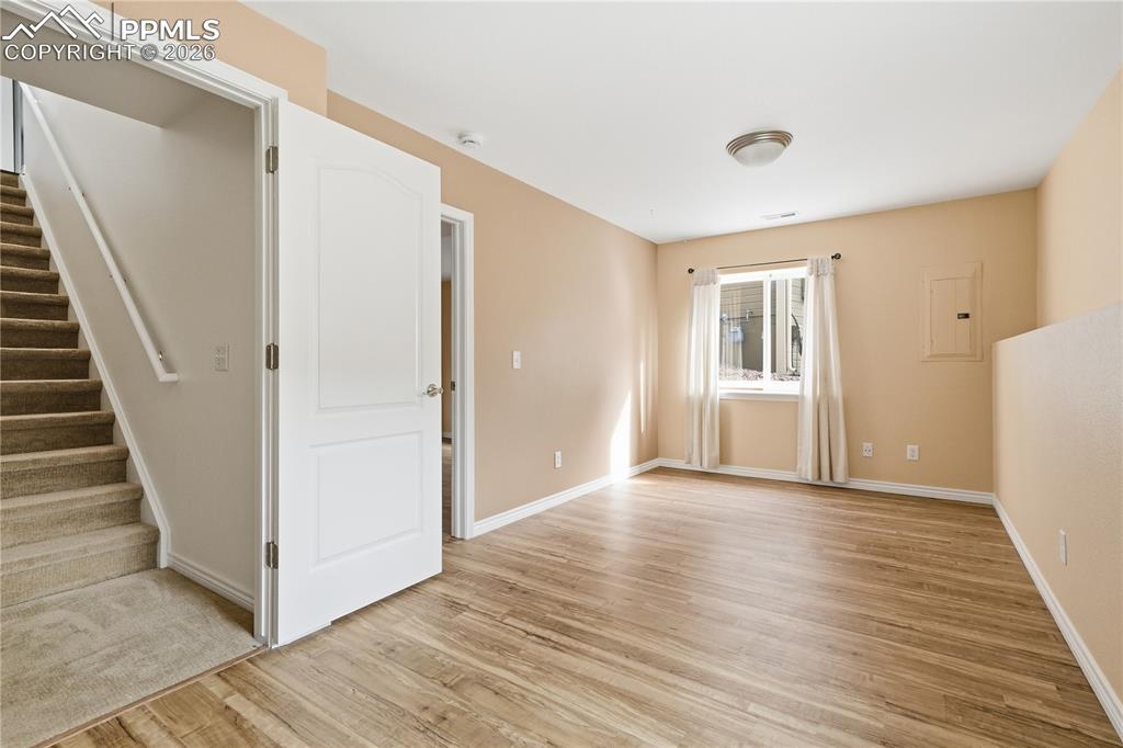 Image 21 of 41: Basement family room features newer LVP