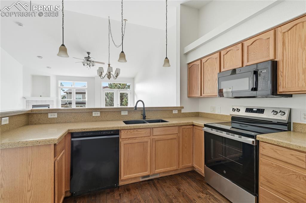 Image 7 of 41: Kitchen is open to the family and dining areas