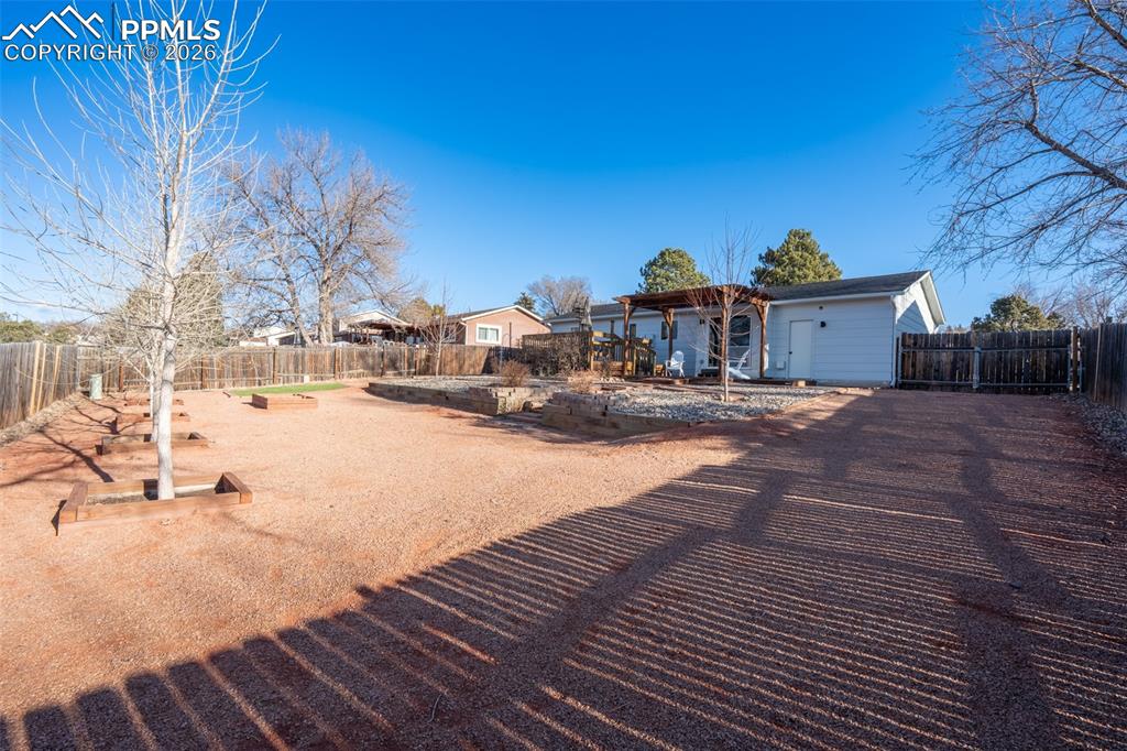 Image 31 of 40: Back yard fully xeriscaped