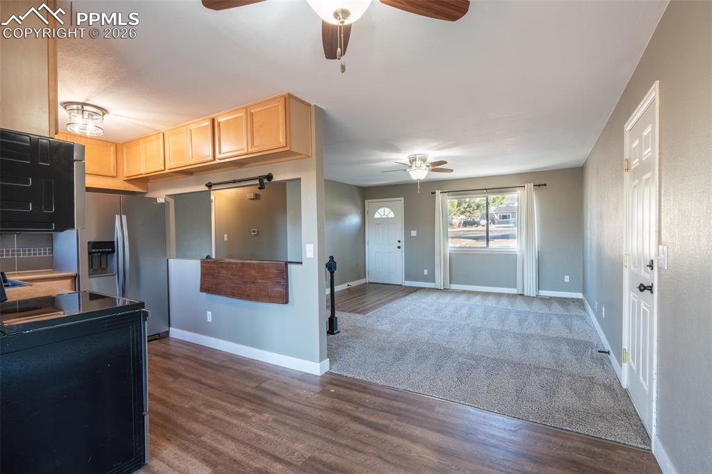 Image 6 of 40: Dining area with walk out/kitchen/living room - main