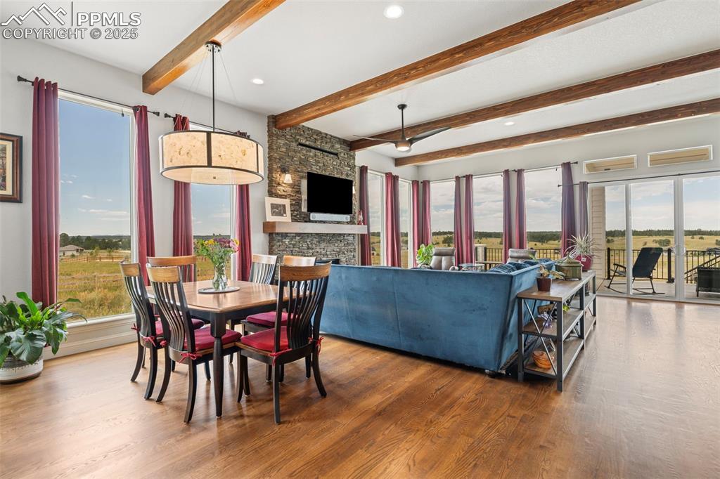 Image 16 of 50: Dining area featuring wood finished floors, beam ceiling, and recessed ligh
