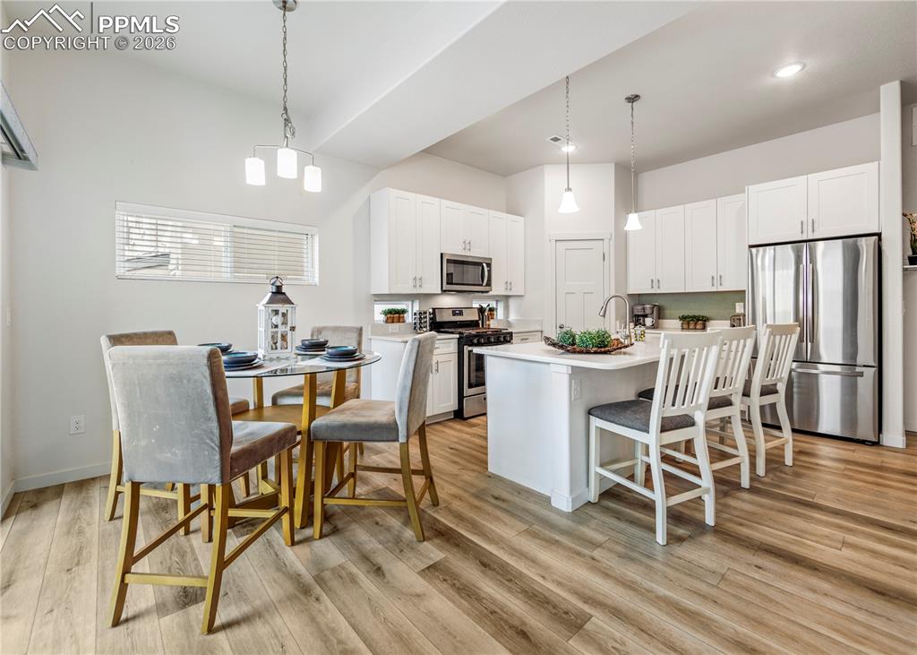 Image 13 of 46: Kitchen featuring light countertops, stainless steel appliances, a kitchen 