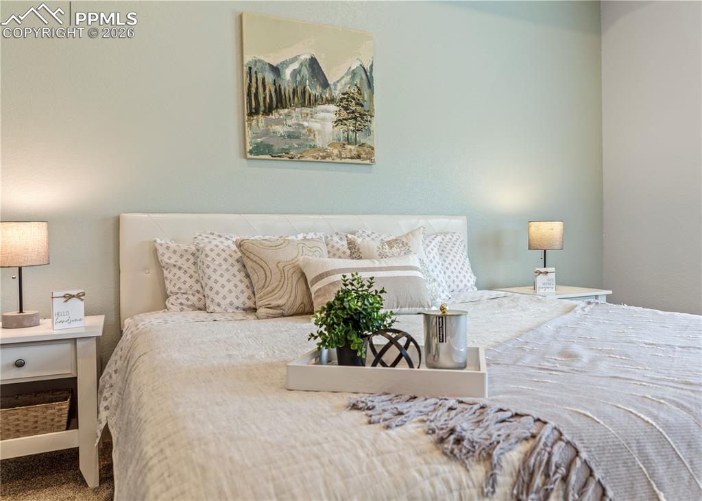 Image 26 of 46: Bedroom with carpet flooring