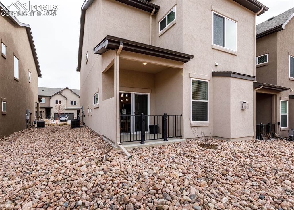 Image 44 of 46: Back of house featuring a patio area and stucco siding