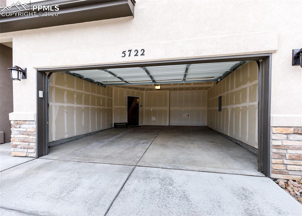 Image 46 of 46: Garage featuring driveway