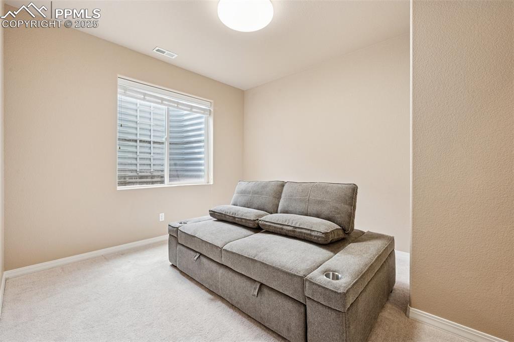 Image 33 of 46: Bedroom with baseboards and carpet flooring