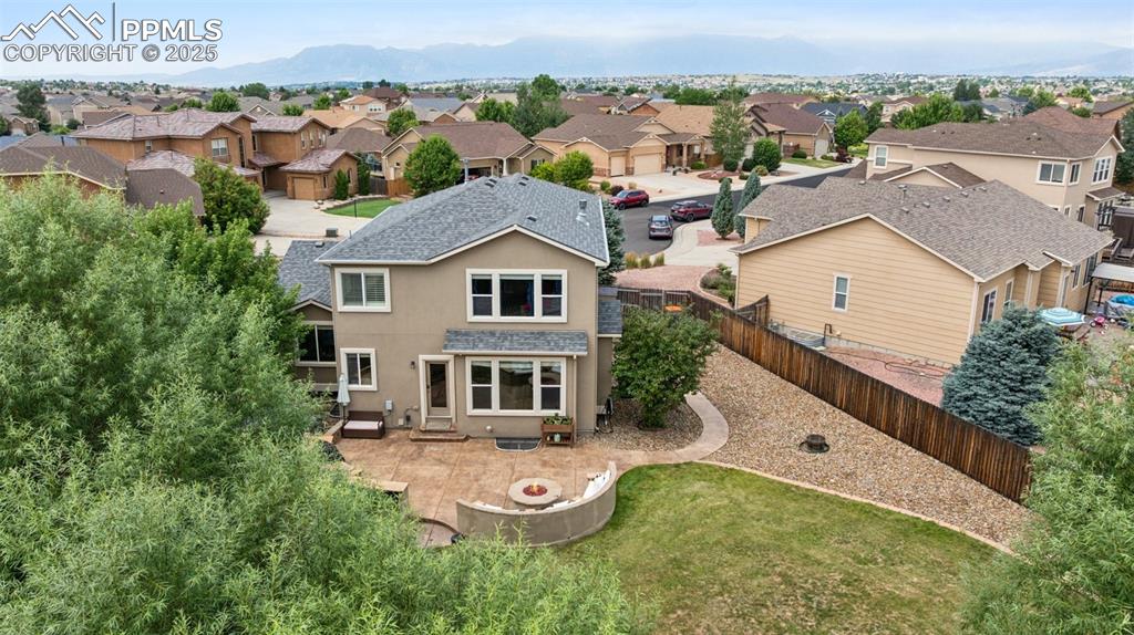 Image 41 of 46: Aerial perspective of suburban area with a mountain backdrop