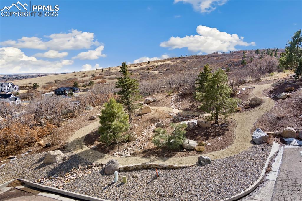 Image 6 of 19: Walking paths landscaped already in yard,